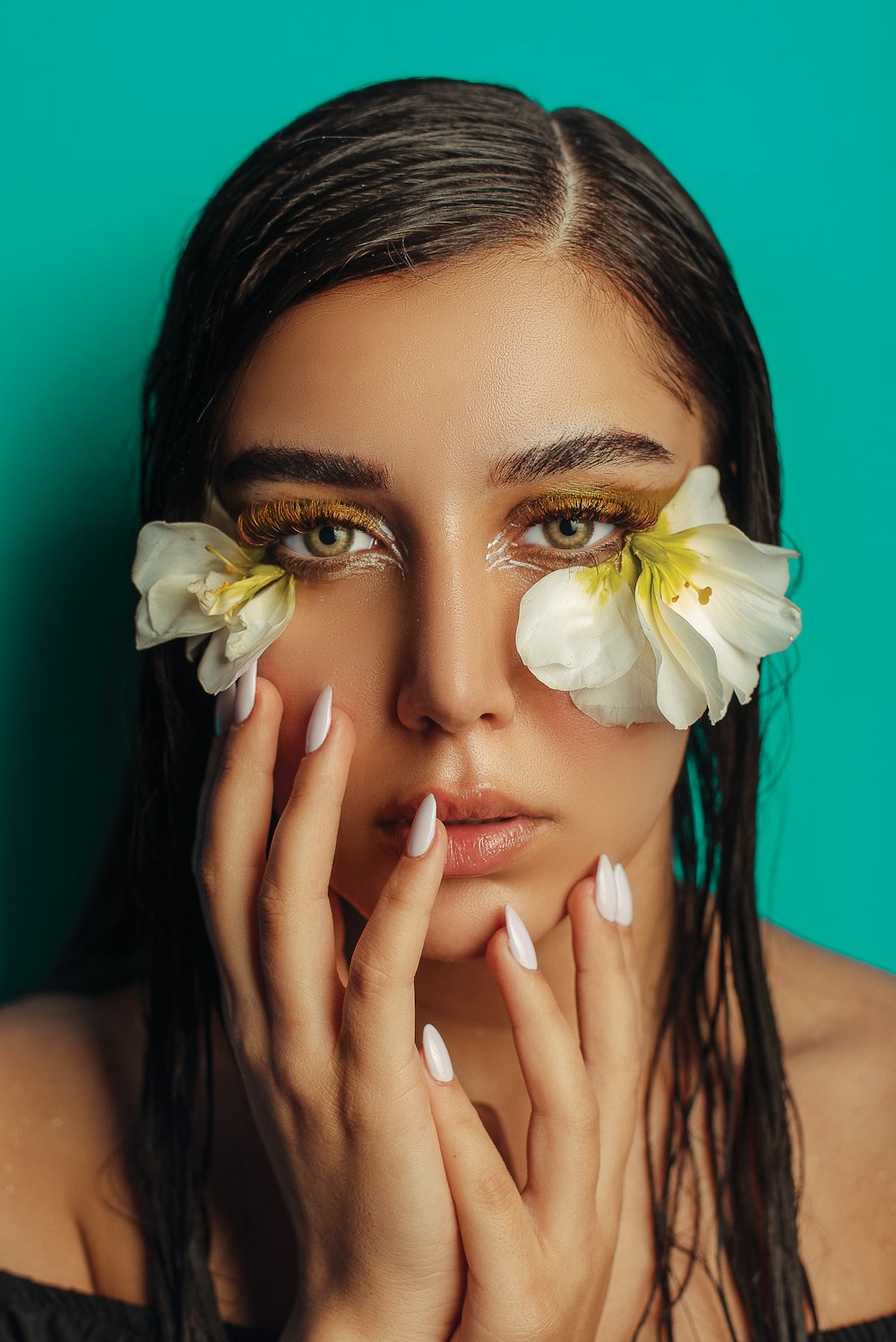 woman with white flower on her face