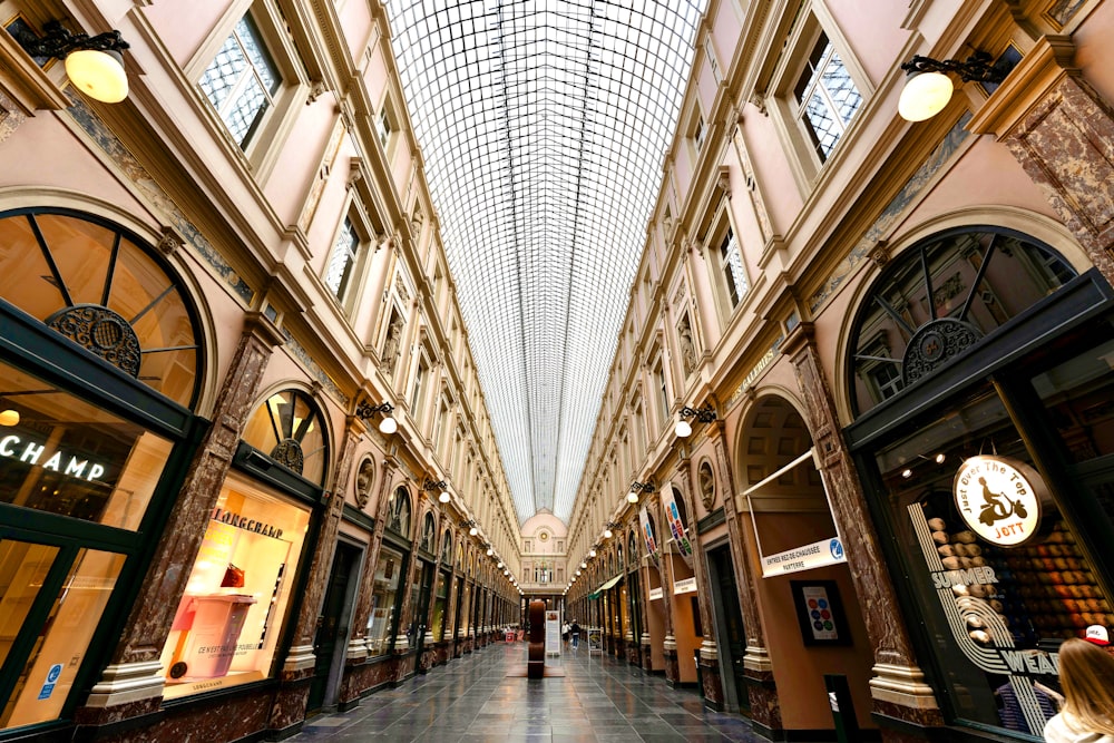 people walking on hallway inside building