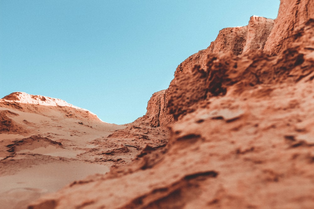 brown rocky mountain under blue sky during daytime