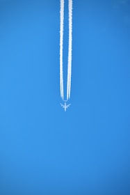silver necklace on blue textile