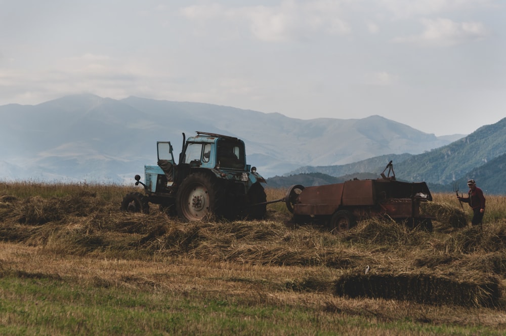 black and brown tractor on brown grass field during daytime