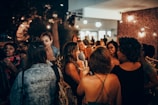 A community gathering with people sharing stories and laughter.