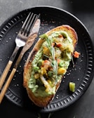 brown and green dish on black plate