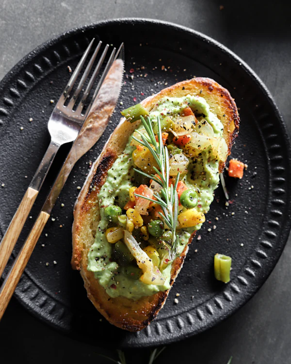 Avocado toast on a dark plate