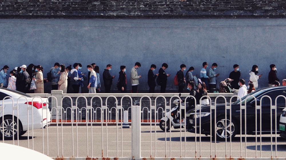 people standing on gray concrete floor during daytime