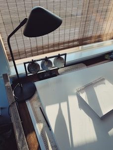 black desk lamp on white table