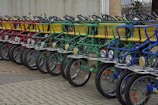 A row of colorful e-bikes lined up, ready for delivery.