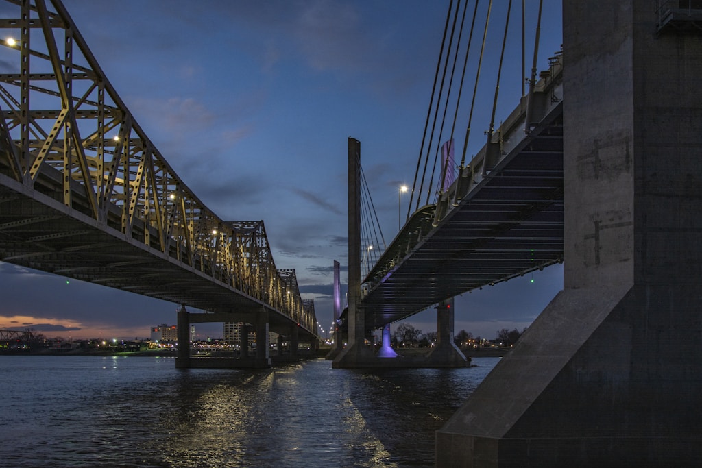 gray bridge over body of water during daytime