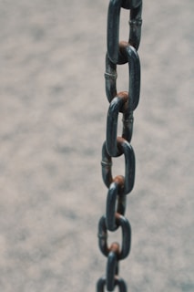 grey metal chain on grey concrete floor