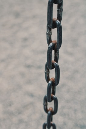grey metal chain on grey concrete floor