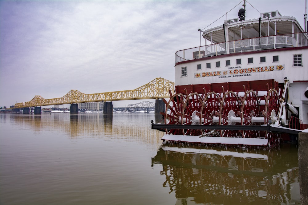 red and white ship on water