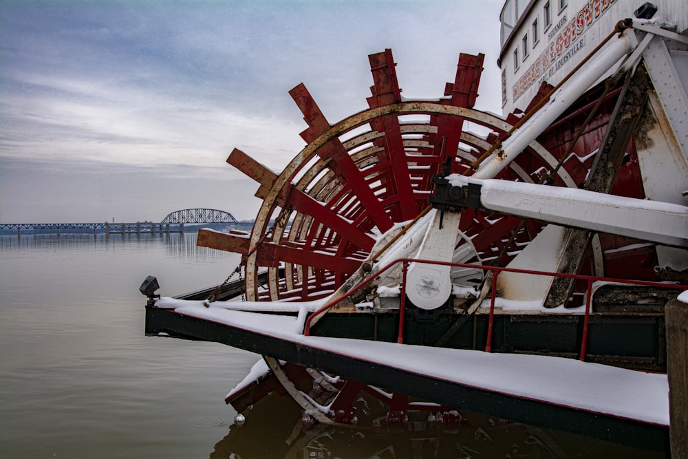 red and white ship on sea during daytime