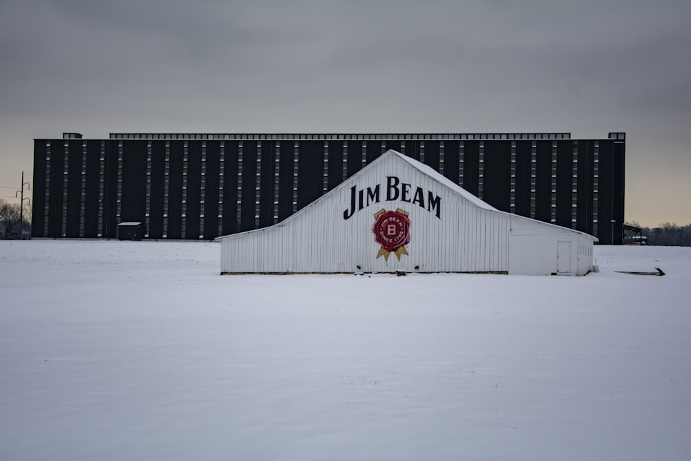 white and red house on snow covered ground