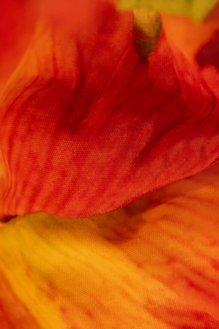 Close-up of folded ambisyon clothing showcasing fabric texture and vibrant colors.