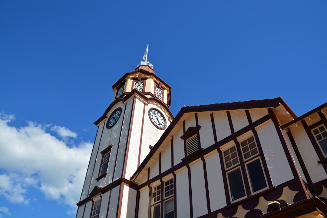 white and brown concrete building under blue sky during daytime