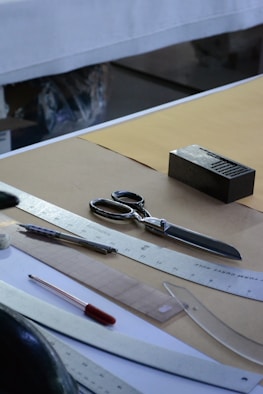 silver scissors beside black box