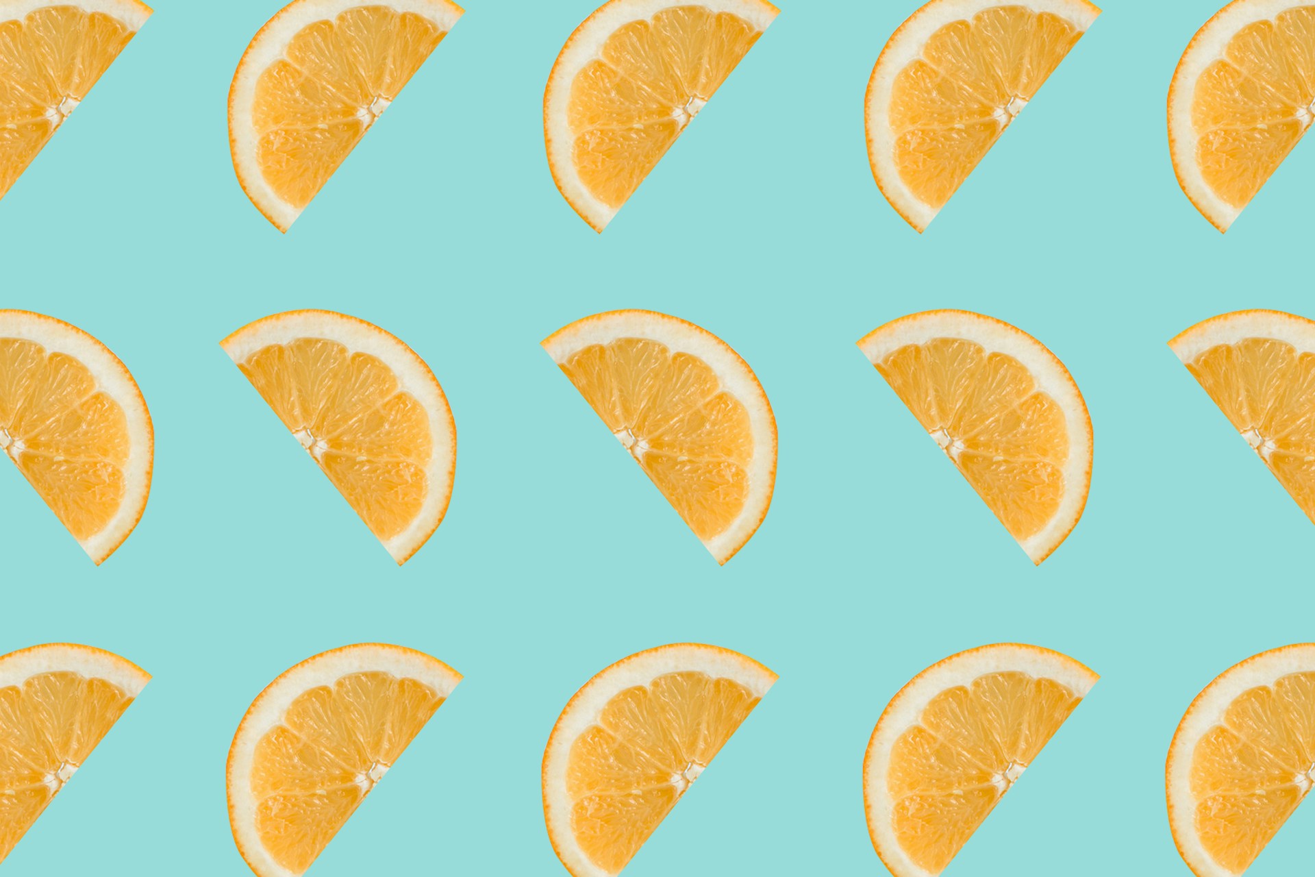 sliced orange fruits on white background