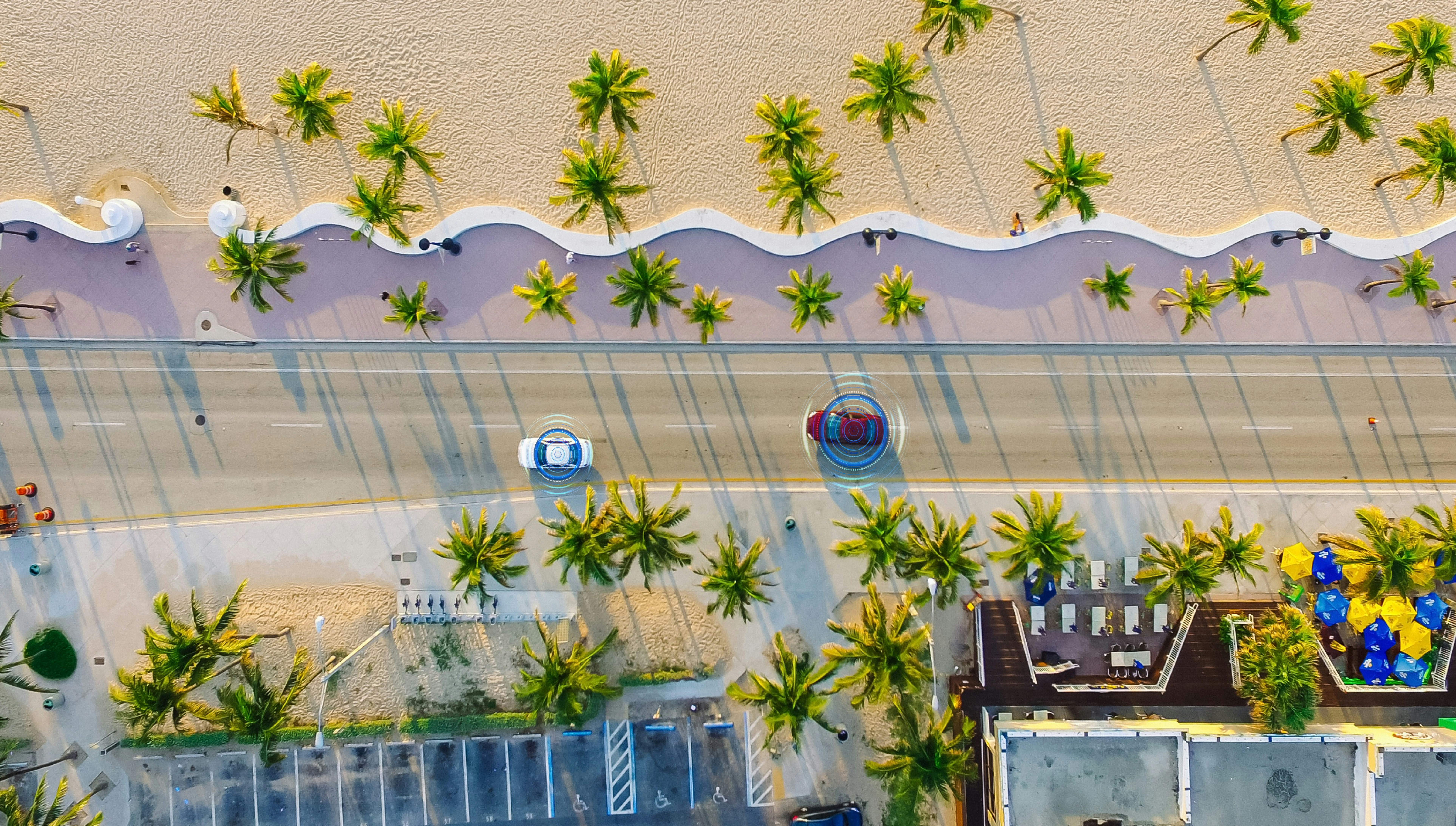 Aerial Drone View: White Autonomous Self Driving Car Moving Through City. Concept: Artificial Intelligence Scans Surrounding Environment, Detecting Cars, Avoids Traffic Jams and Drives Safely.