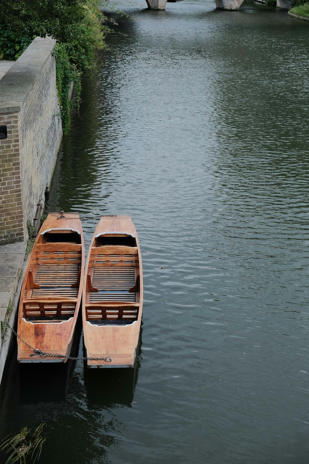 brown wooden boat on river during daytime