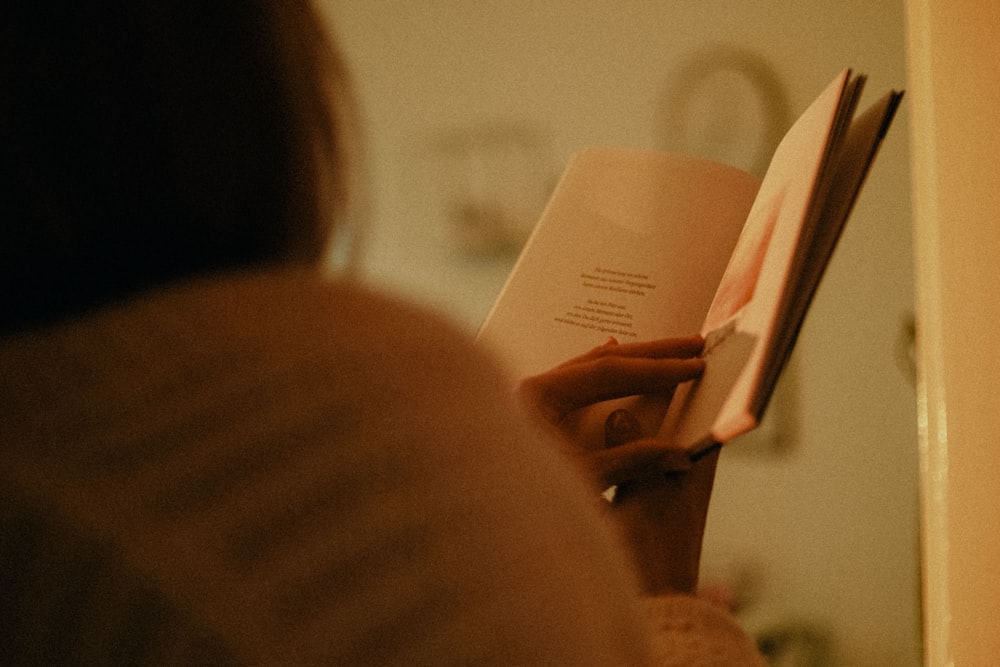 woman holding white printer paper