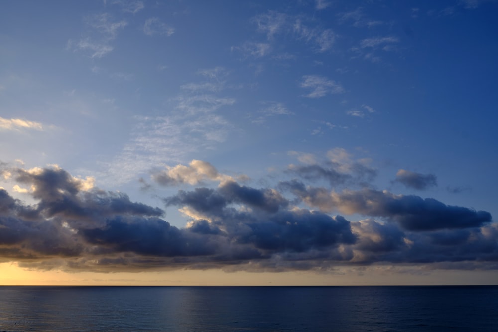 blue sky and white clouds over the sea