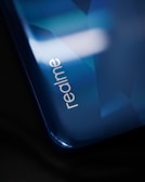 black smartphone on black surface