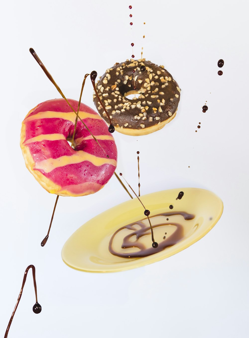 brown and white doughnut on white ceramic plate