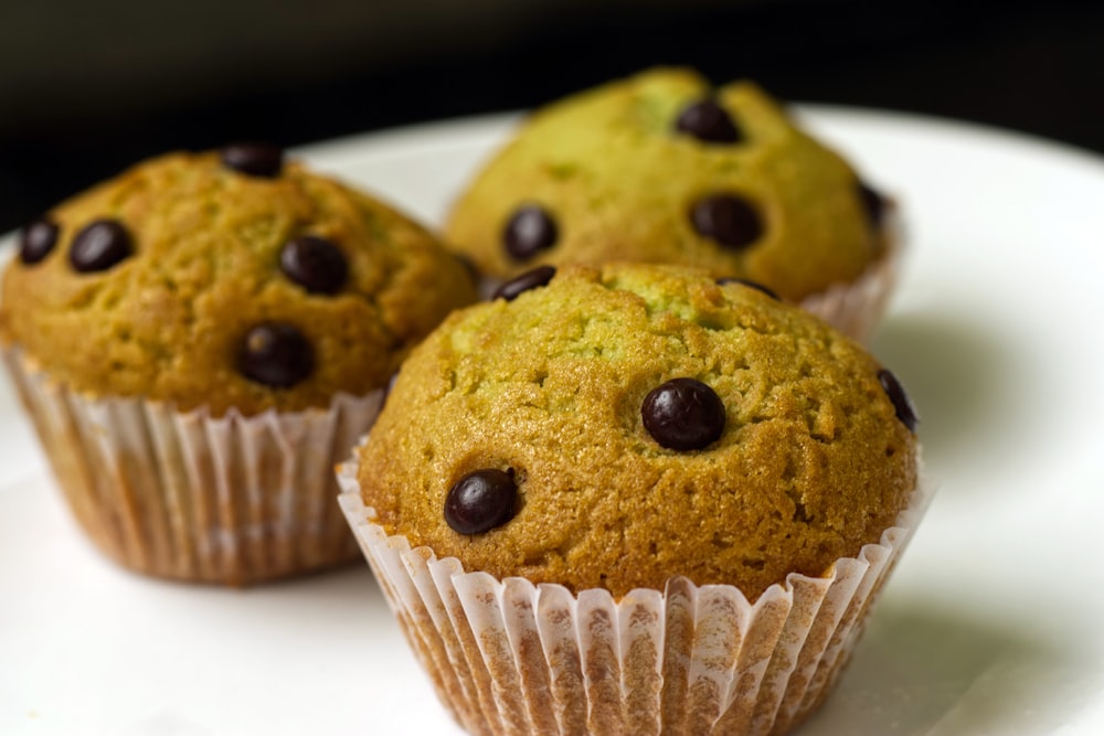 brown cupcake on white ceramic plate