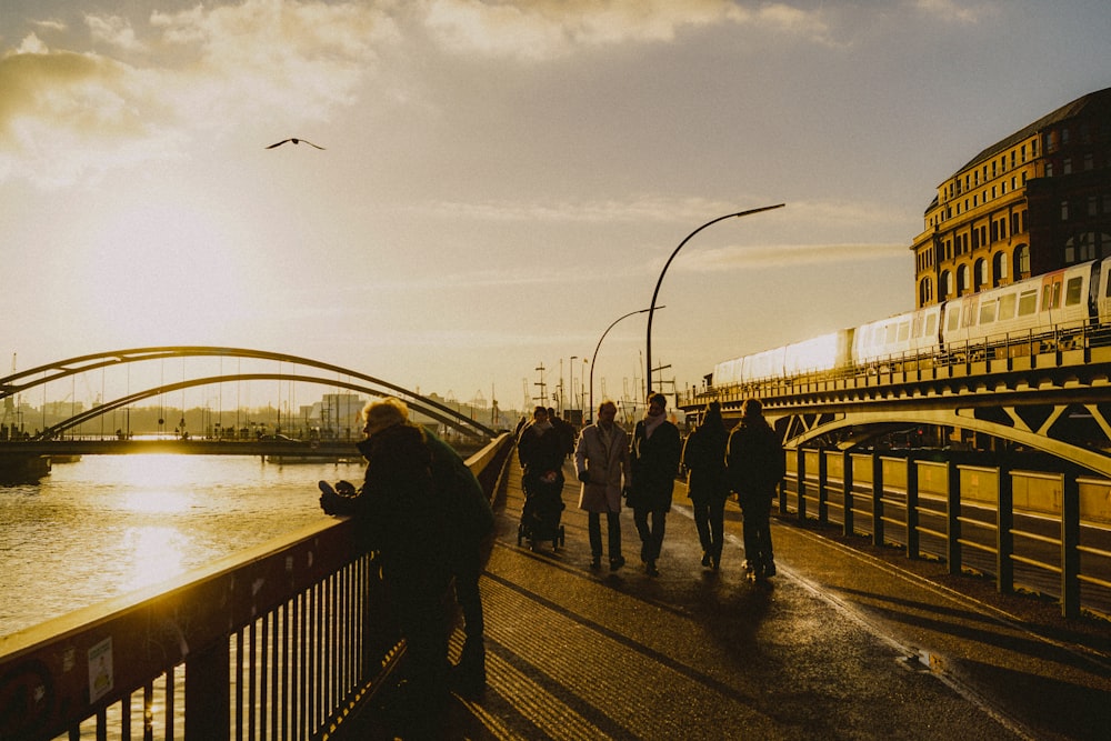 people walking on bridge during daytime