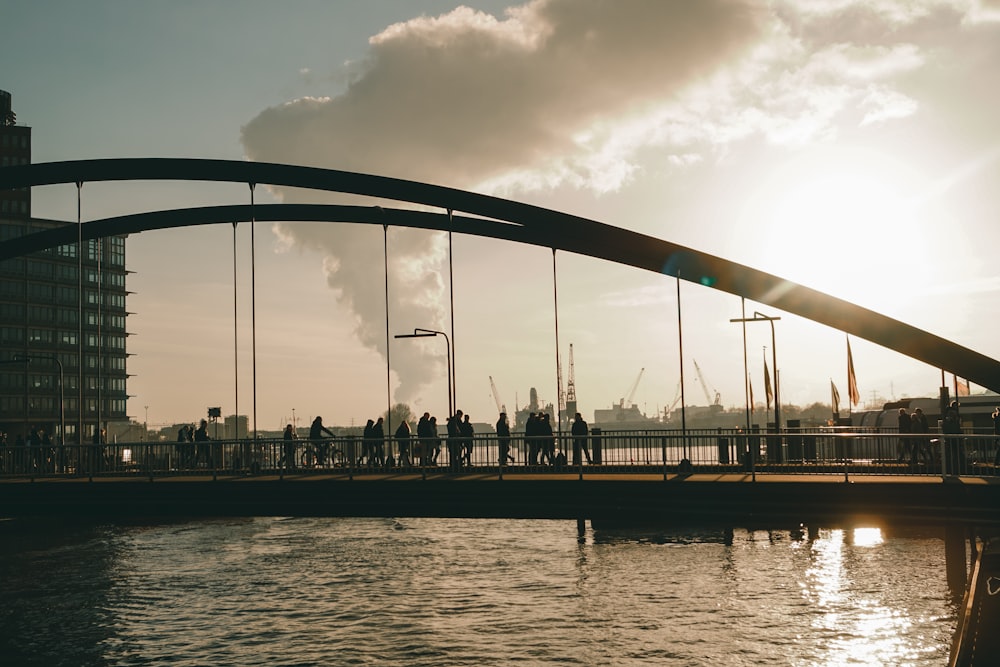 people walking on bridge during daytime