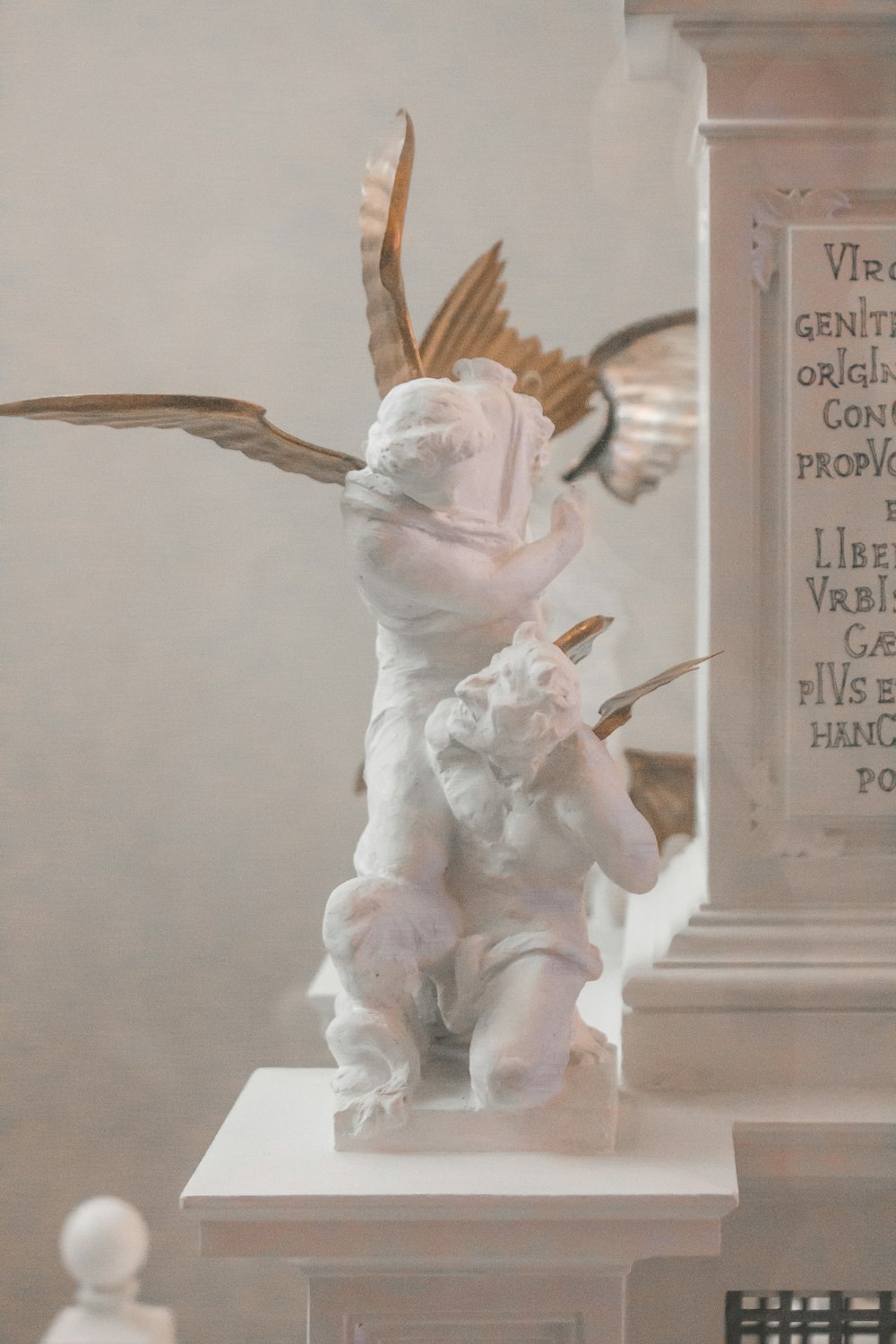 angel holding bird ceramic figurine