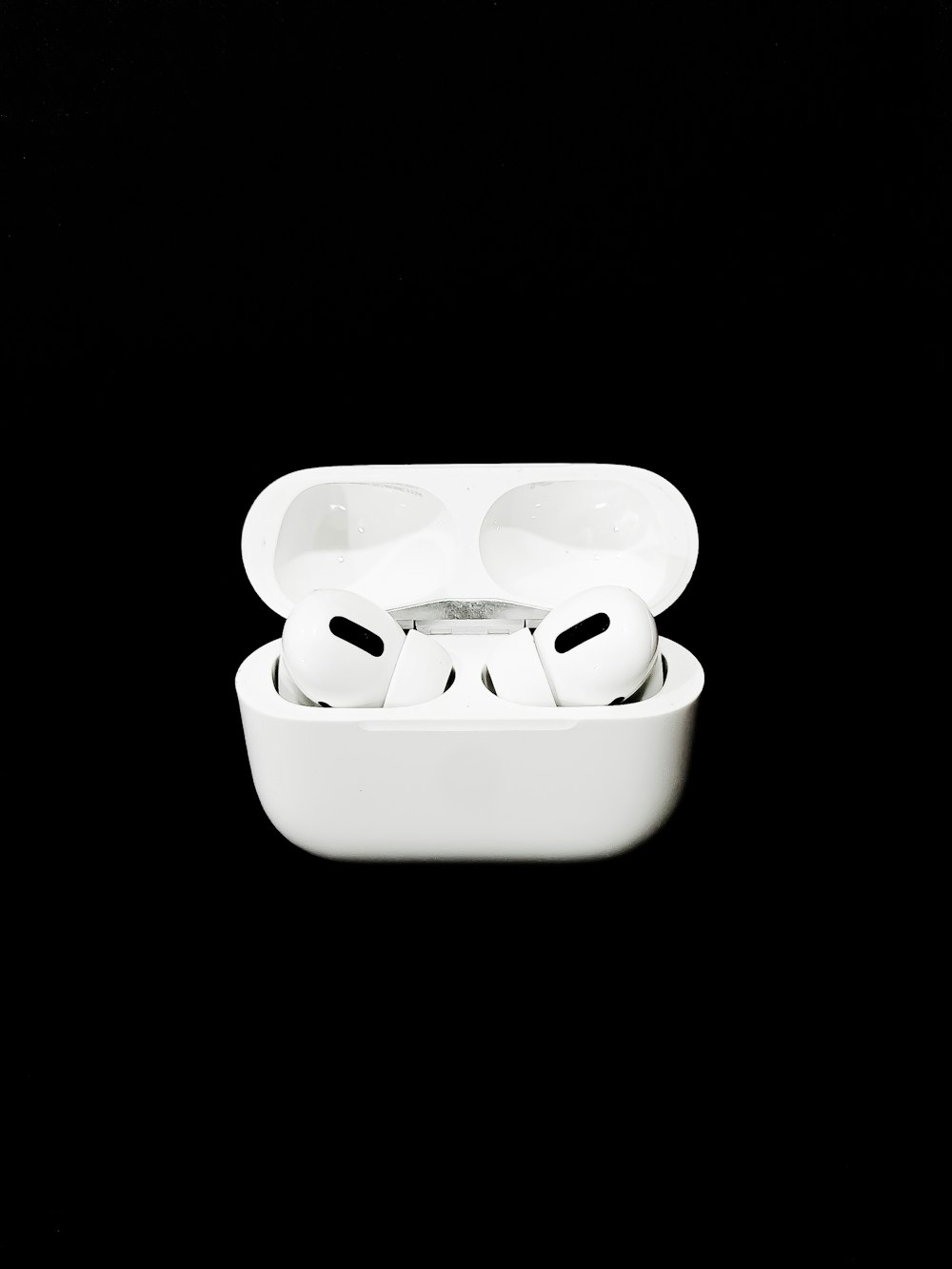 white apple earpods in white case