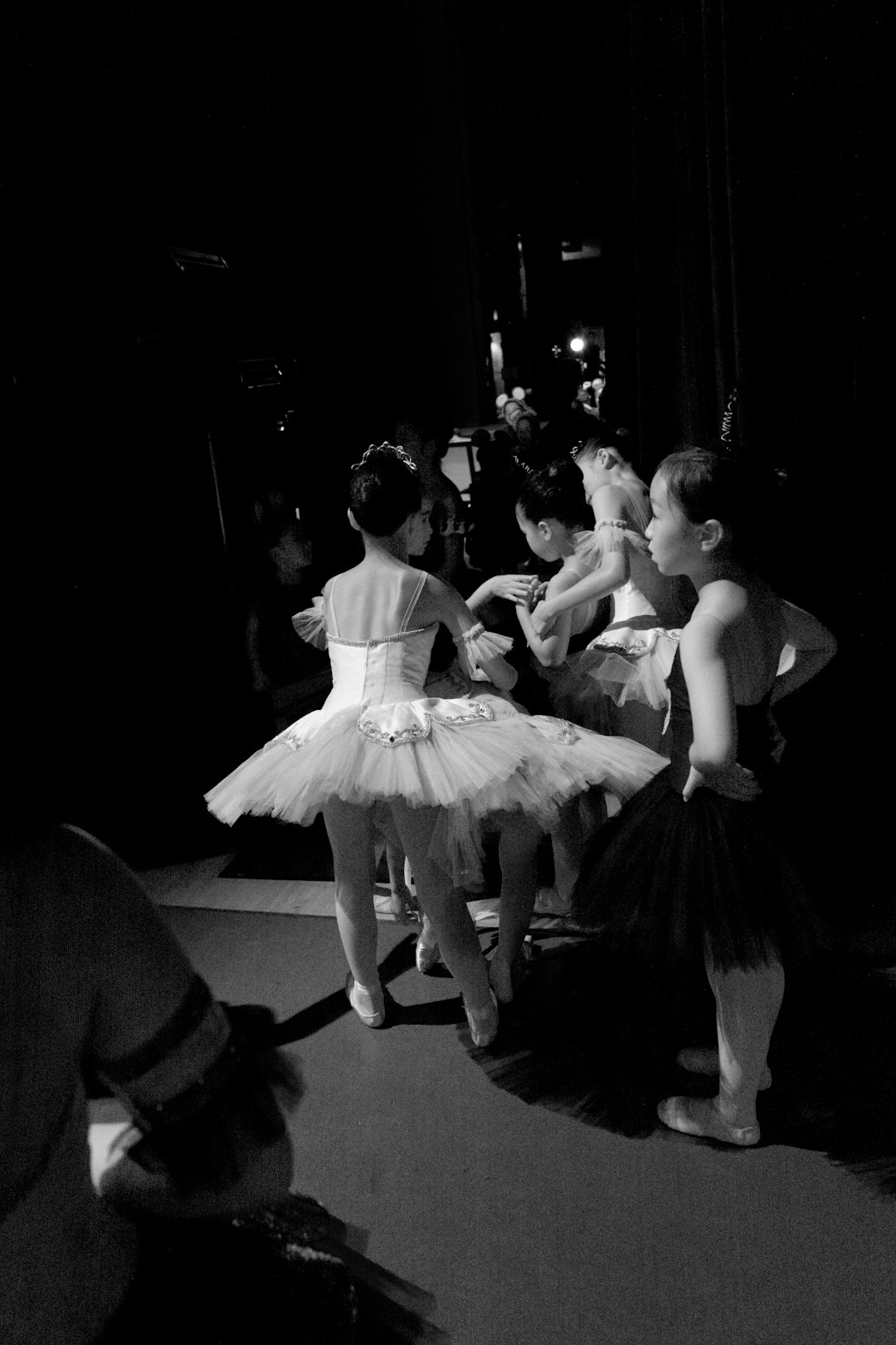 grayscale photo of woman in white dress dancing