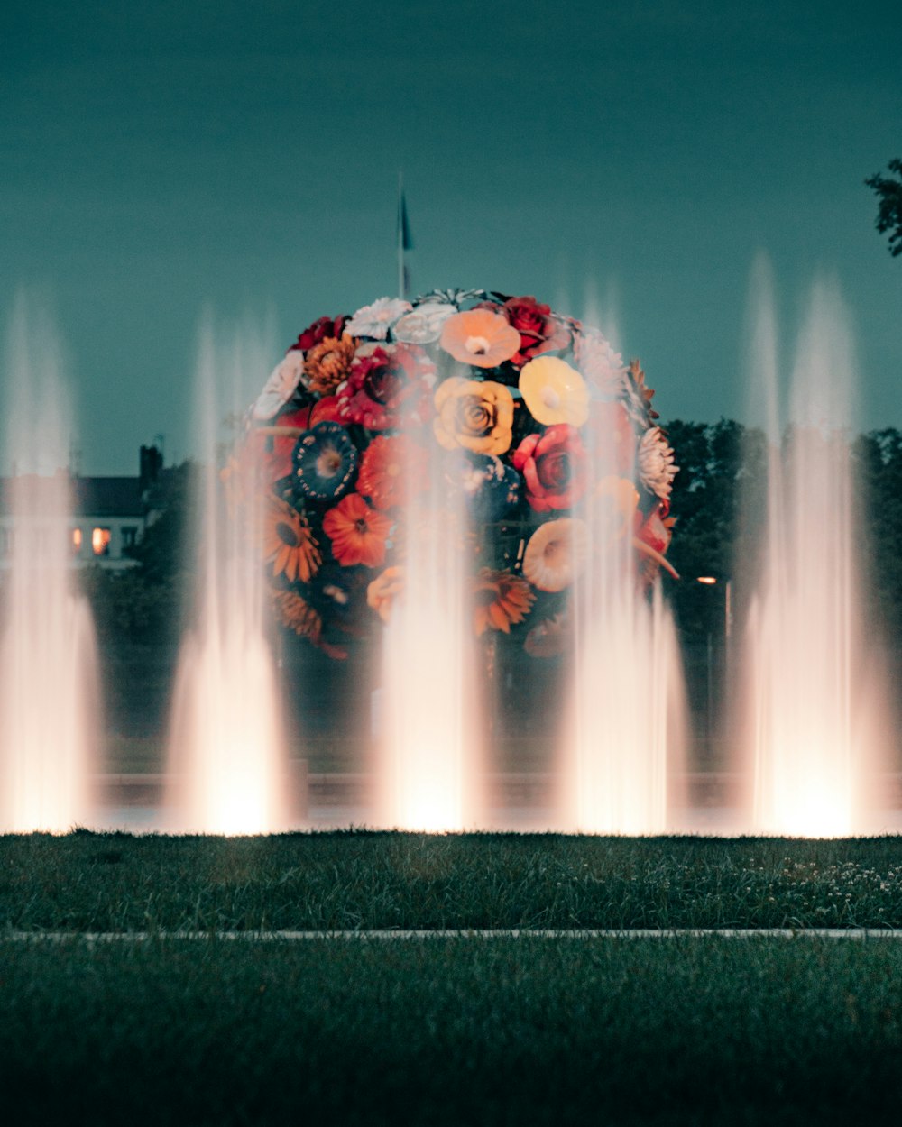yellow and red lighted outdoor fountain