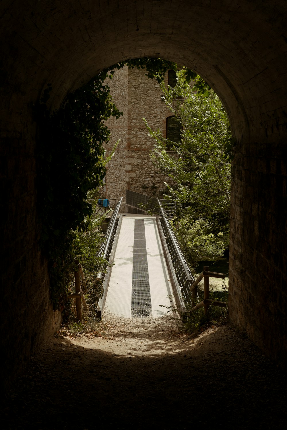 a tunnel with a ramp going through it