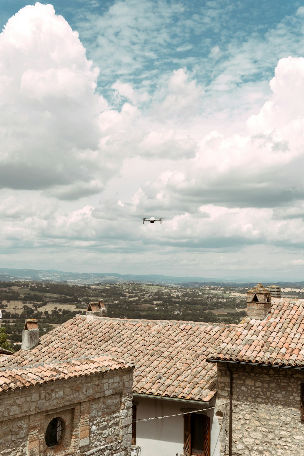 an airplane is flying over a small village