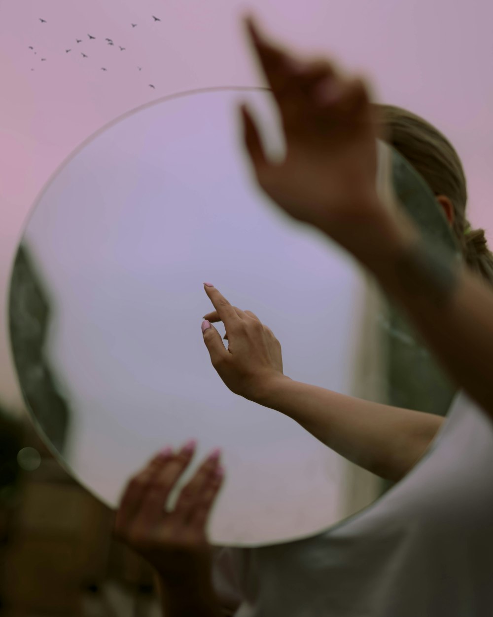 person in white shirt with hand on air