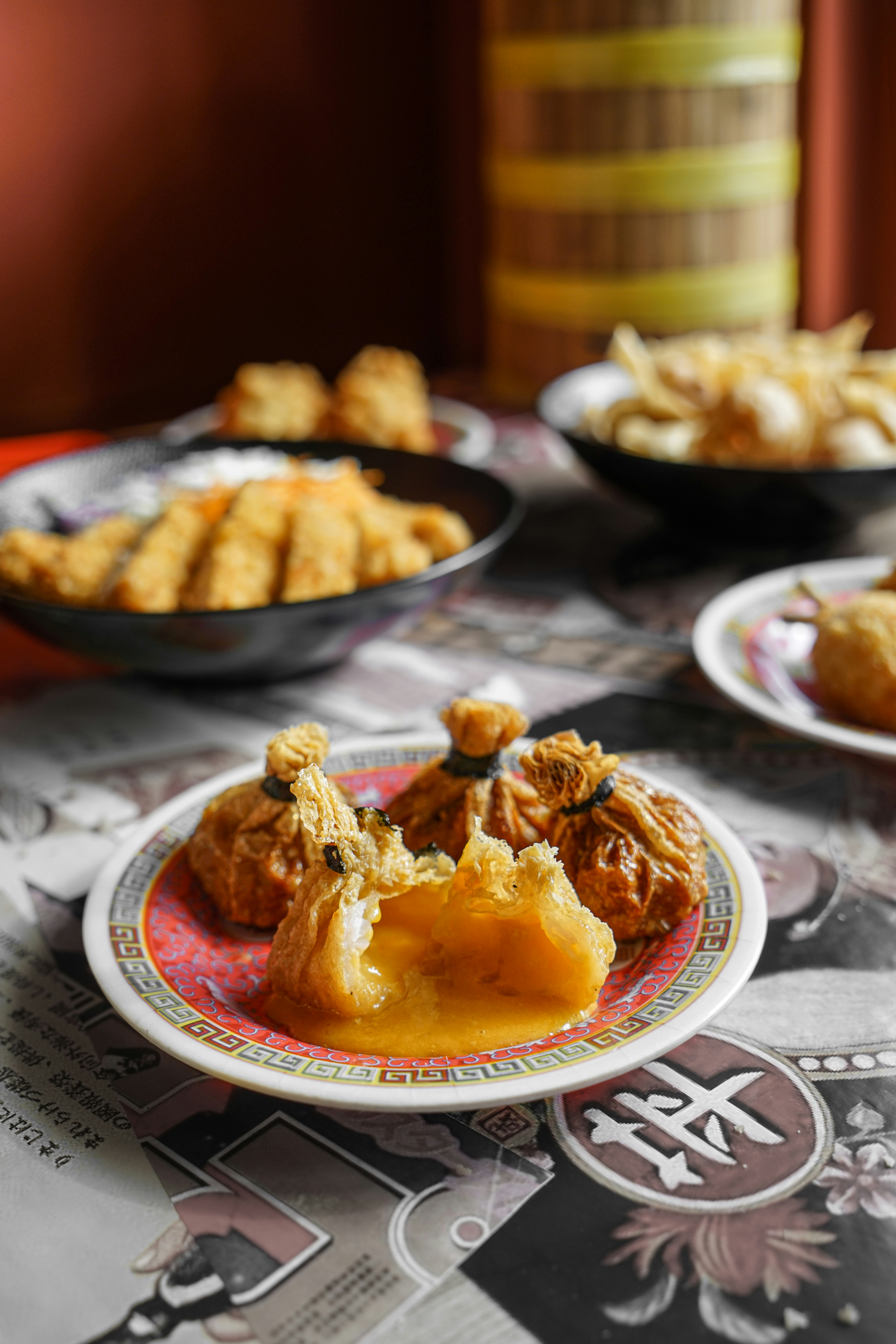 Cooked food on red and white ceramic plate