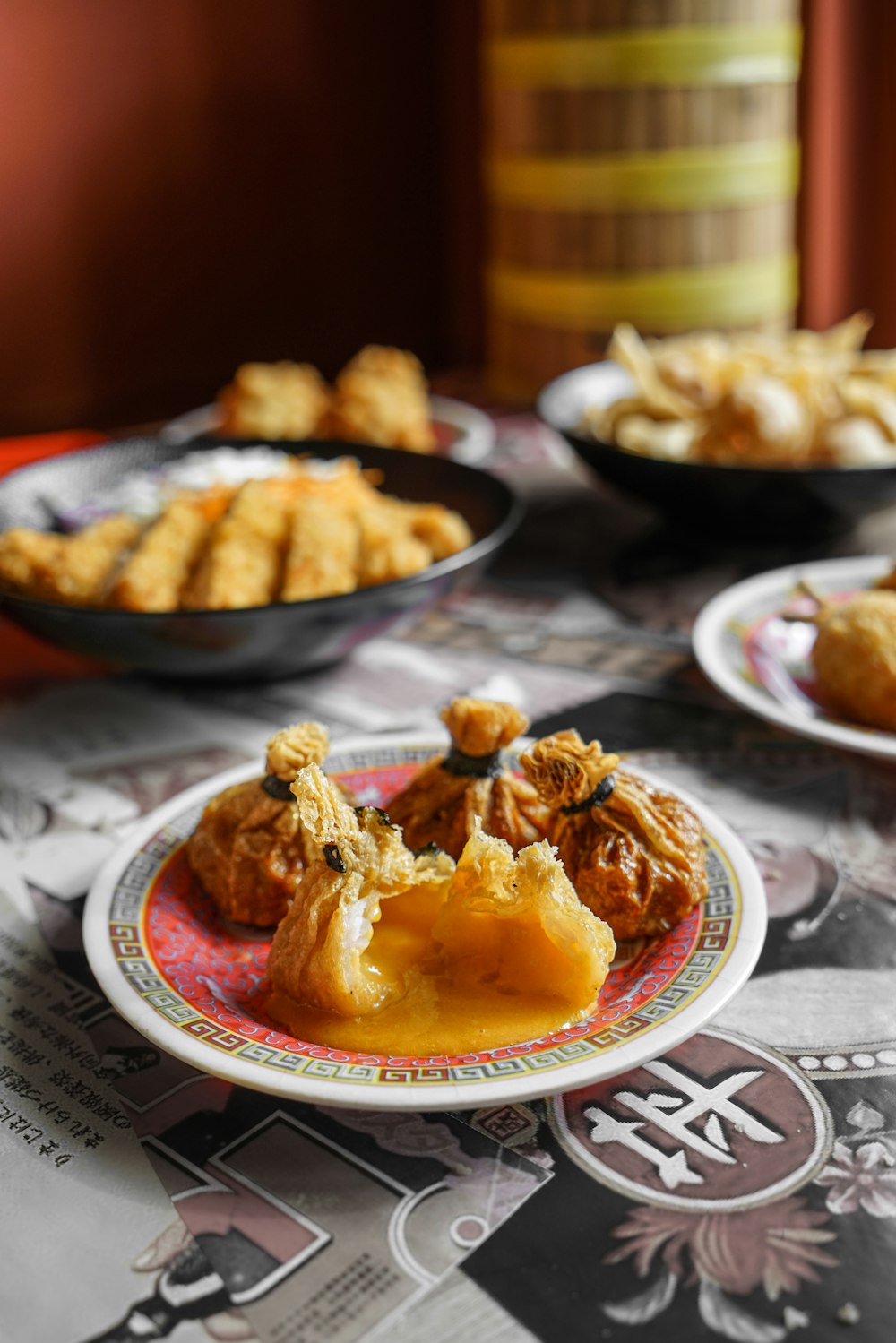 cooked food on red and white ceramic plate