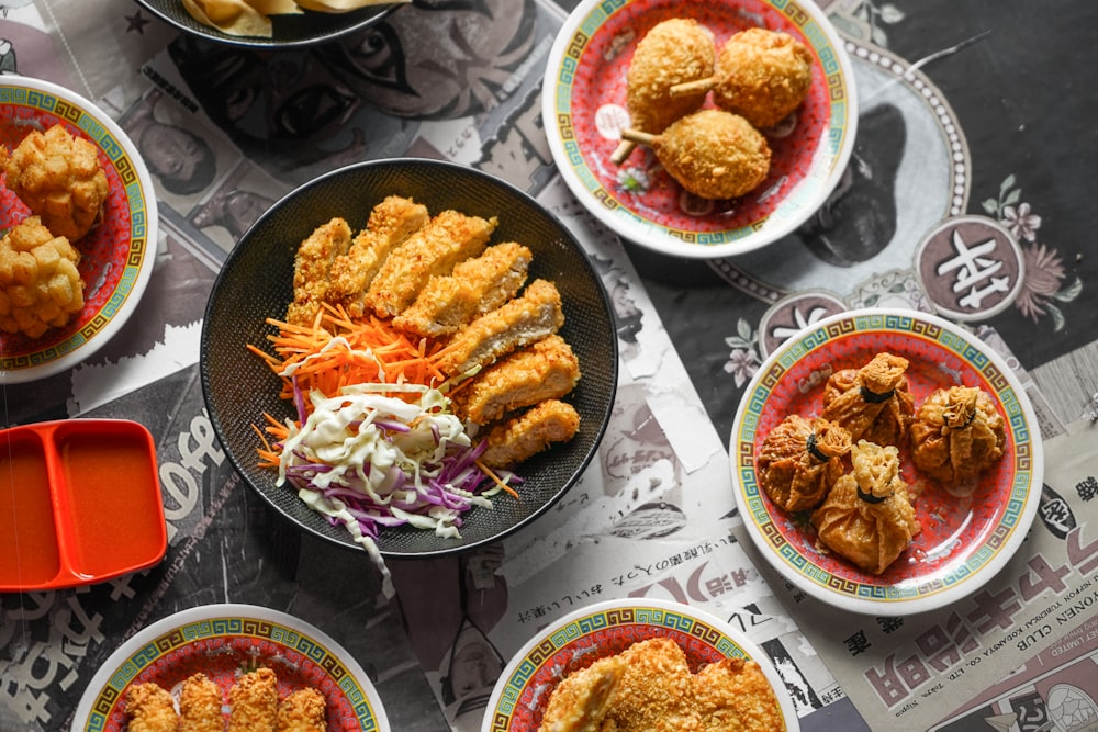 cooked food on black ceramic plates