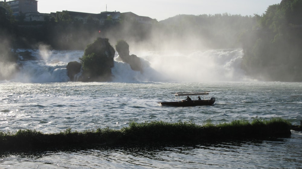 person riding on boat on water