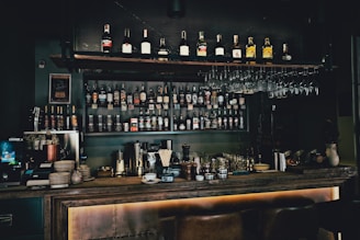 bottles on brown wooden shelf