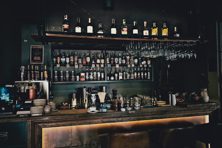 bottles on brown wooden shelf