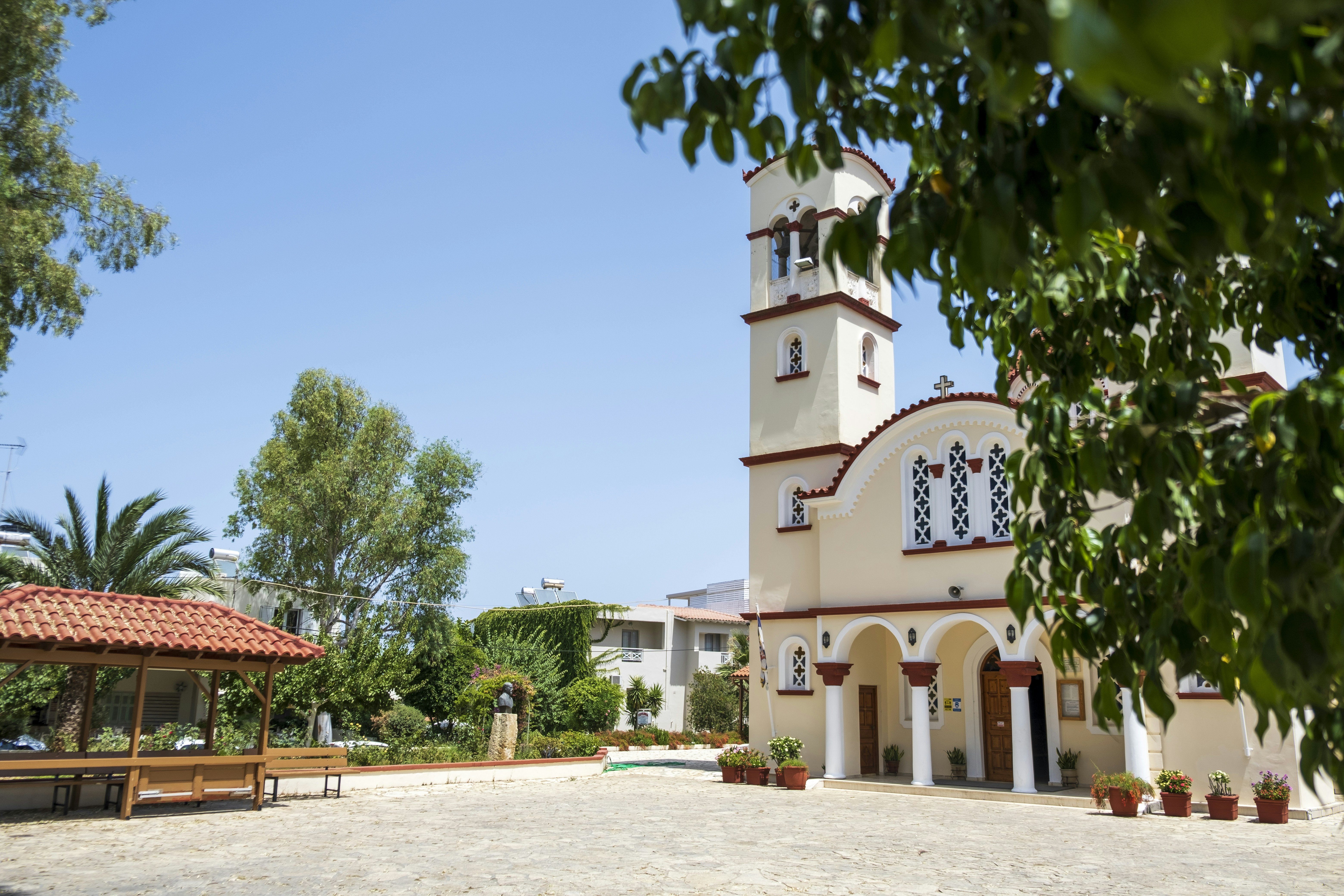 woman wearing yellow long-sleeved dress under white clouds and blue sky during daytime