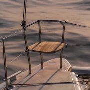 brown wooden chair on white boat during daytime
