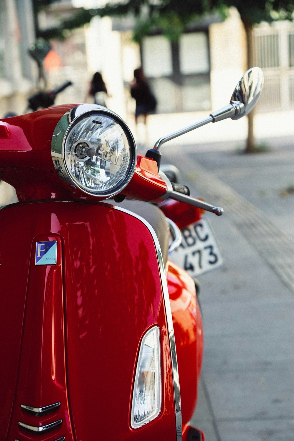 red and black motorcycle on road during daytime