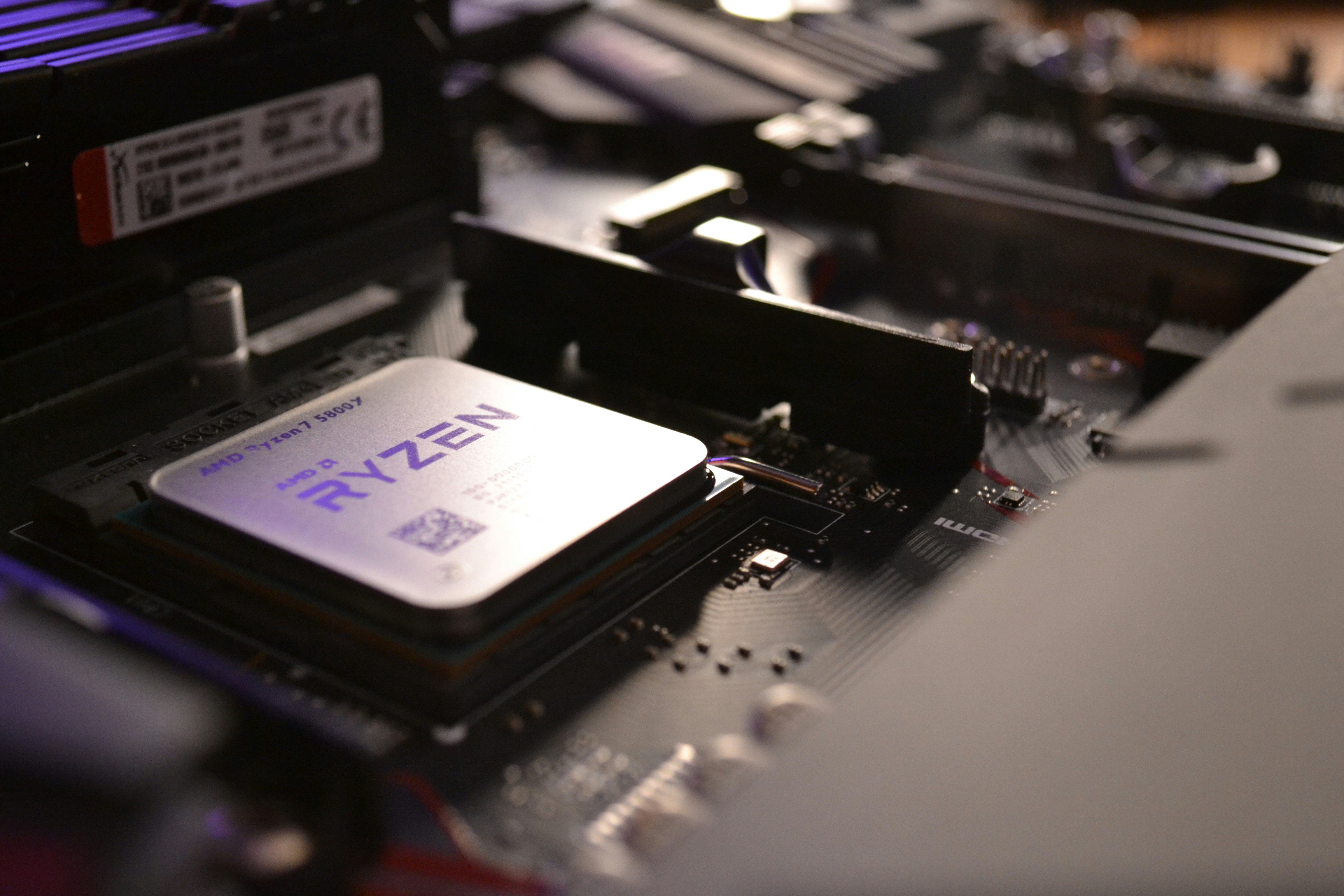 AMD Radeon RX GPU on dark surface, red accent lighting, product photography