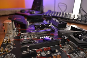 Close-up of computer components and tools on a table.