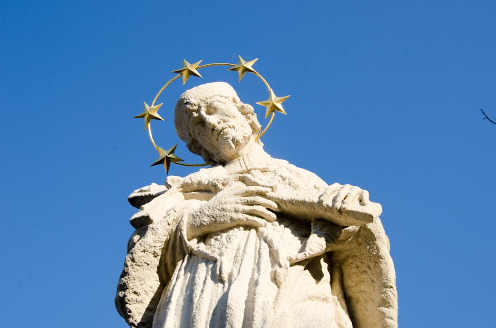 white concrete statue under blue sky during daytime