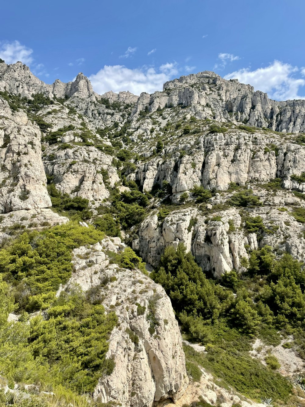 gray rocky mountain under blue sky during daytime